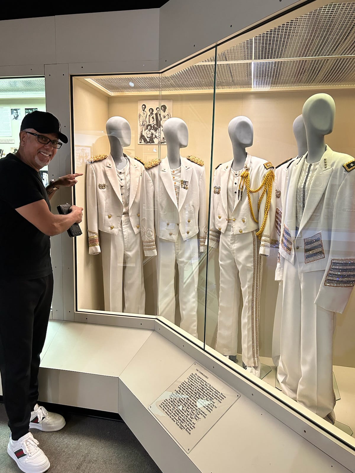 J.D. Nicholas of The Commodores viewing the original Nightshift stage costumes designed by Ian Carter, permanently displayed at Alabama Music Hall of Fame